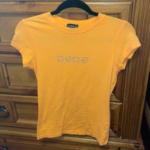 BEBE orange shirt sleeve